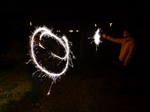 FZ024585 Jenni and Phill setting of sparklers in the garden.jpg